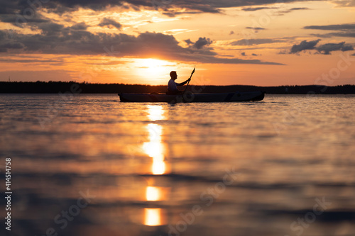 Kayaking in sunset 
