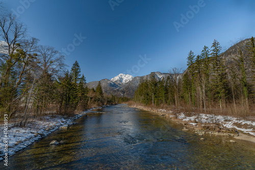 Koppentraum river near bridge with snowy hills and blue water