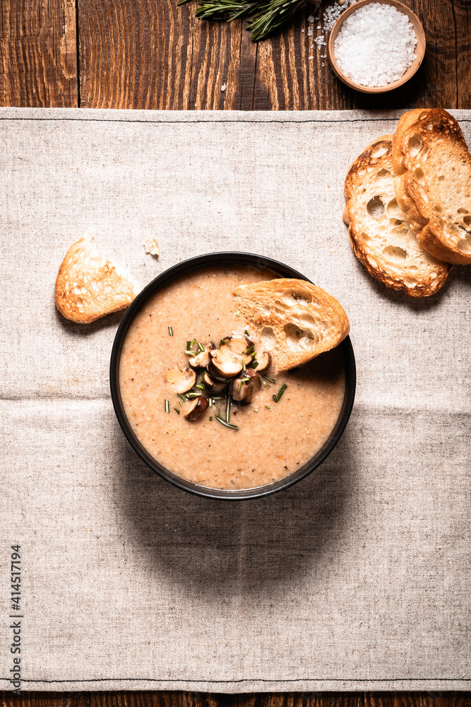 Mushroom cream soup served with toasted bread
