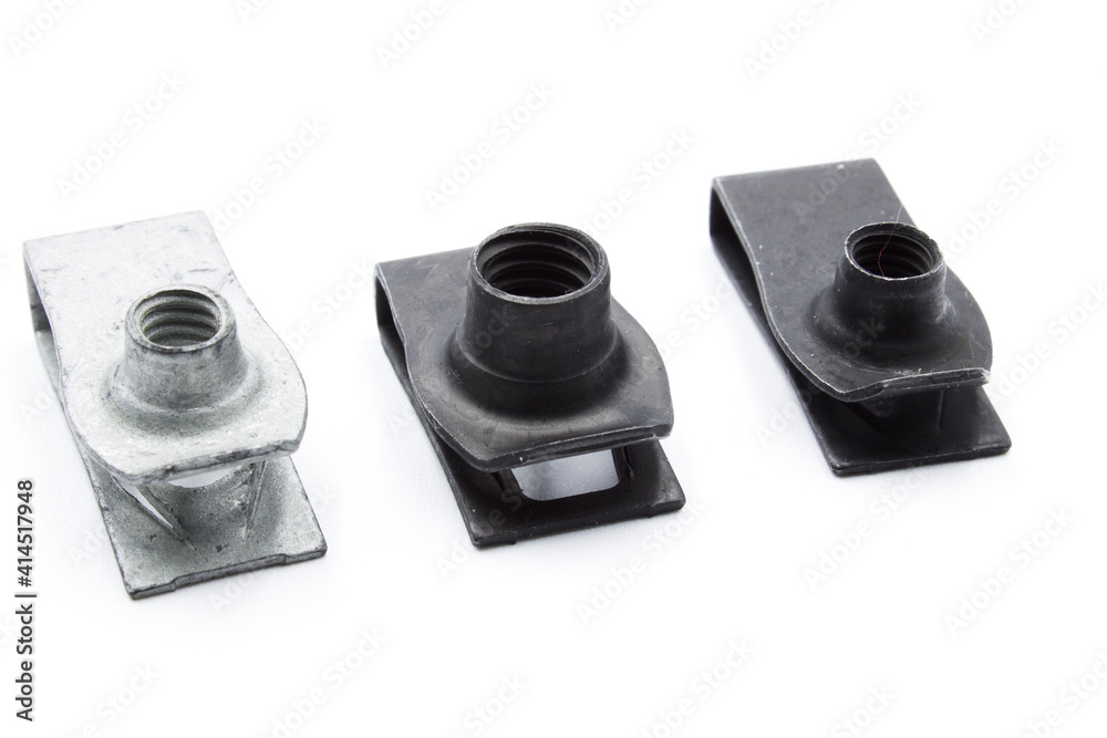 Metal automotive clip for trim on a white background Metal automotive clip for trim on a white background