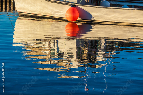 Canada, Prince Edward Island, Malpeque. Fishing boat reflection. photo