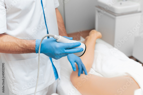 Ultrasound machine for body shape correction in the hands of a doctor
