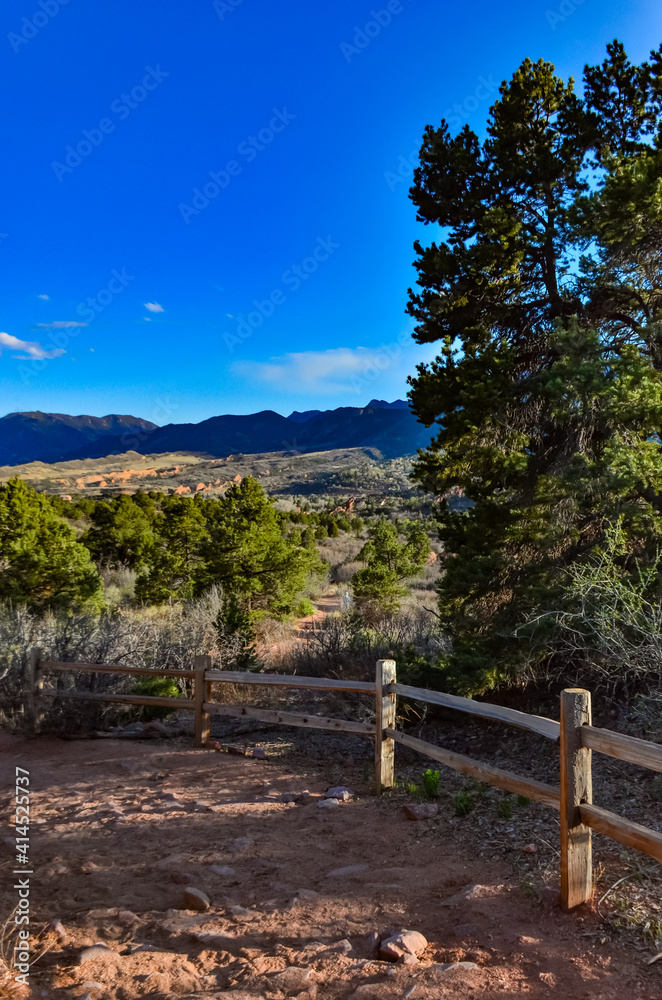A wooden fence with a shadow from the sun, Garden of the Gods, US A wooden fence with a shadow from the sun, Garden of the Gods, US