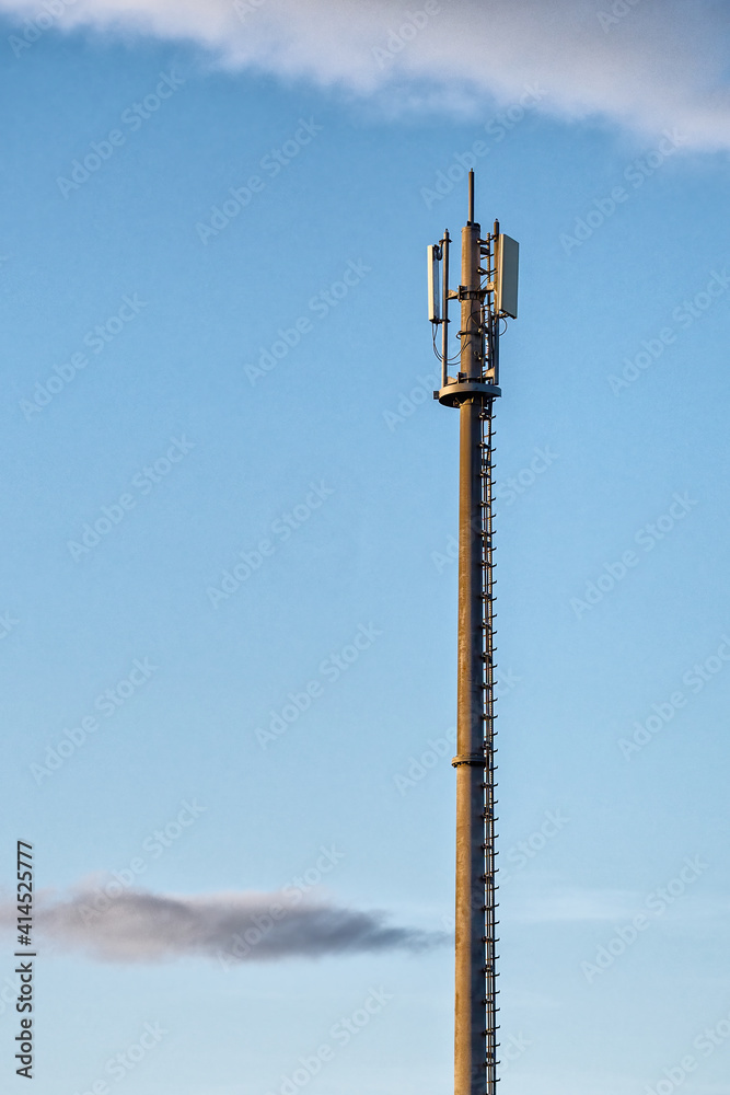High pole with telecommunication transmitter.