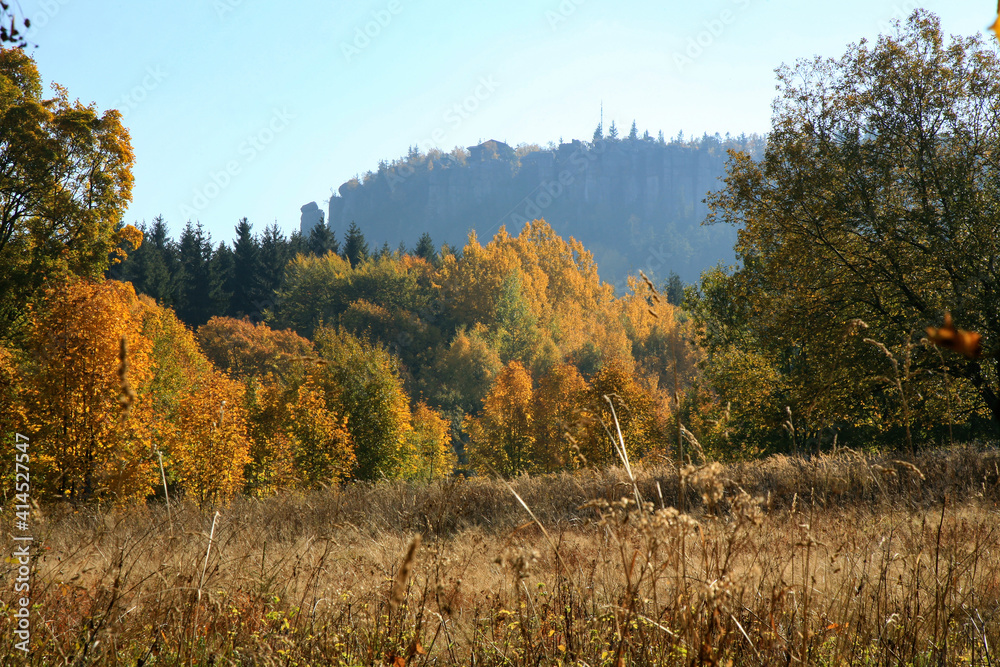 Autumn view on peak Stolowe Mountains from Pasterka village in Poland. Szczeliniec Wielki, Great Szczeliniec. 
