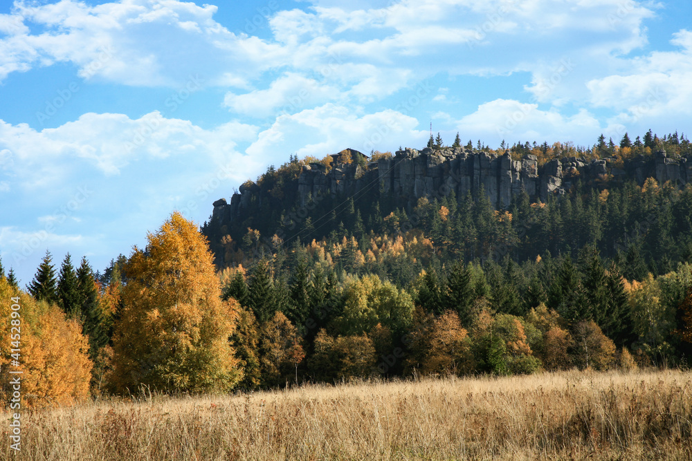 Autumn view on peak Stolowe Mountains from Pasterka village in Poland. Szczeliniec Wielki, Great Szczeliniec. 