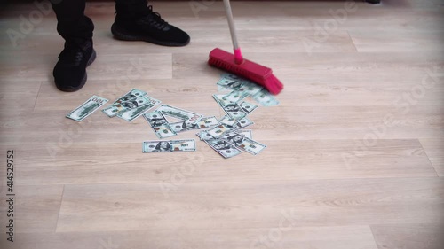 Sweep money on the floor with a brush.