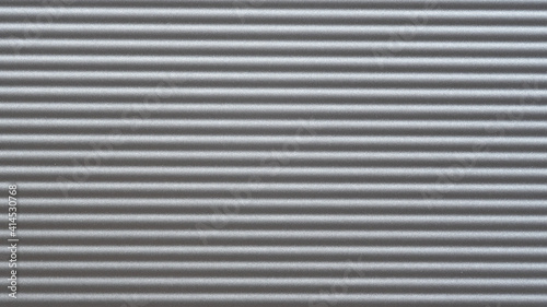 The texture of aluminium with horizontal fluting, background.
