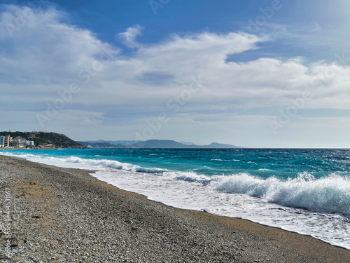 beach view with wild water in rhodes