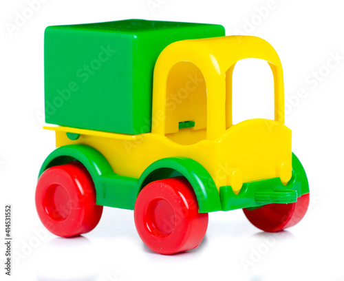 plastic toy truck on white background isolation © Kabardins photo