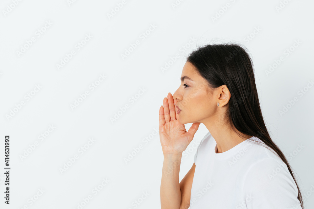 Side view young beautiful woman making announcement or telling secret