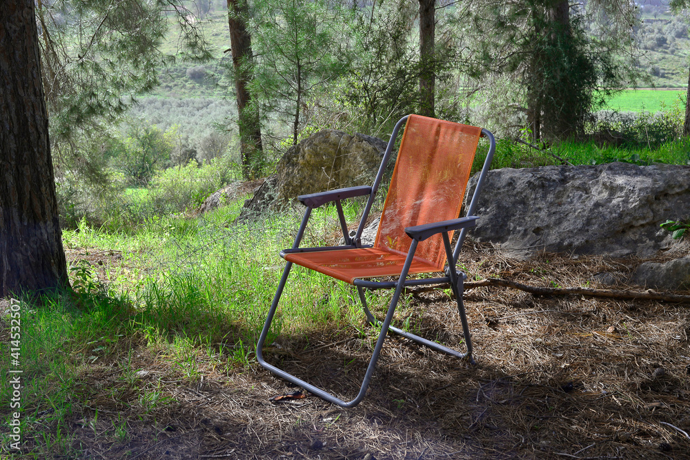 empty camping chair for Outdoor Camping in forest empty camping chair for Outdoor Camping in forest