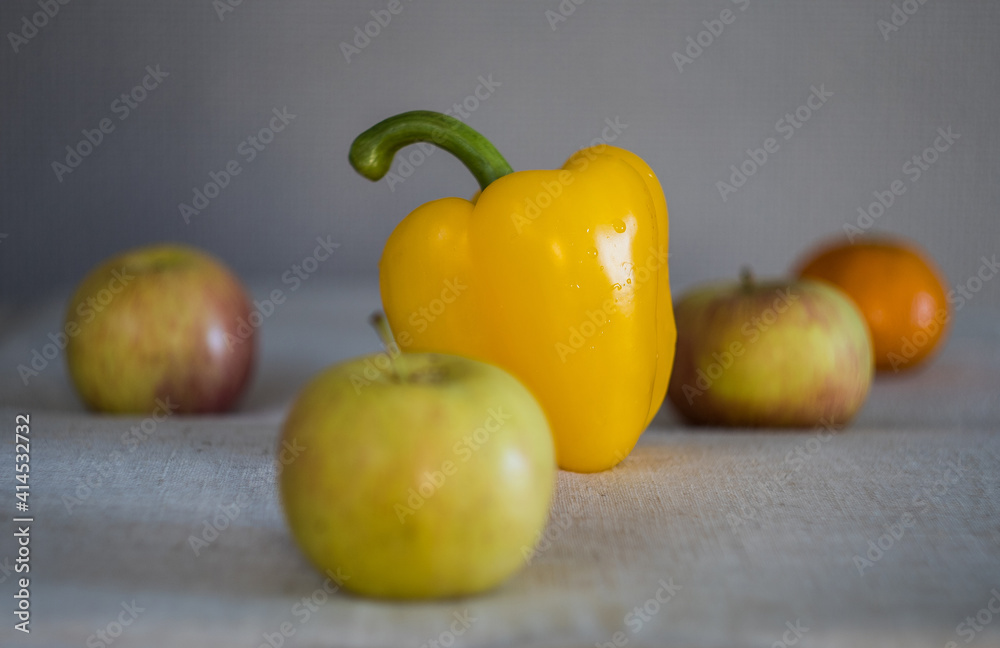 apples orange and sweet bulgarian yellow pepper