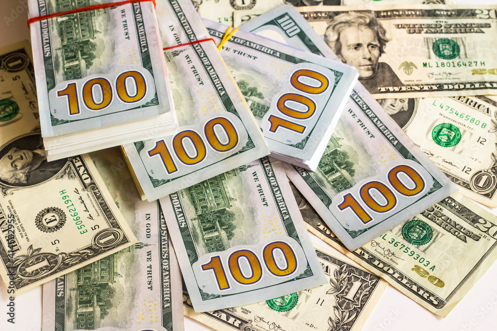 American dollar banknotes with back side on white surface,above view American dollar banknotes with back side on white surface,above view