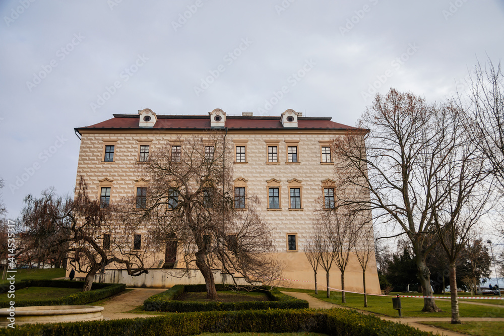 Renaissance castle with Sgraffito decorated facade, chateau with park, footpath in garden on sunny winter day, Benatky nad Jizerou, Central Bohemian, Czech Republic