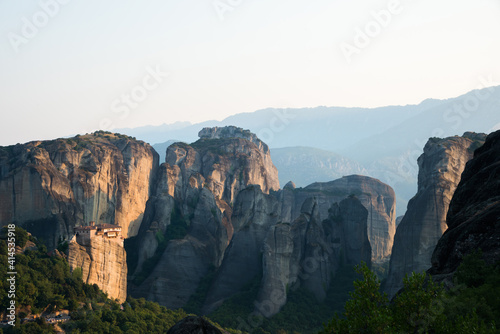Impressive view of Meteora Mountains and Monastery close to sunset © Majopez