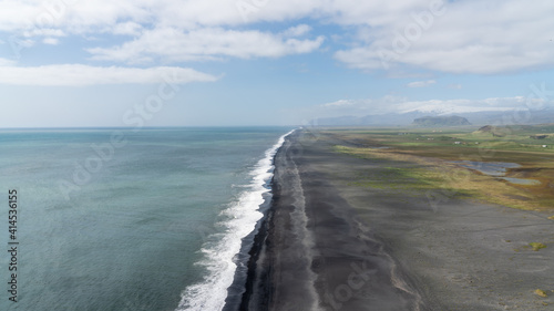 Endless volcanic black sand beach located in Vik, Iceland