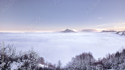 Foggy winter landscape in Ligurian Apennines mountains in Lombardy, Italy.