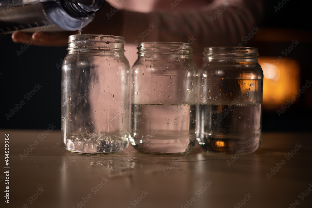 pouring water into glasses pouring water into glasses