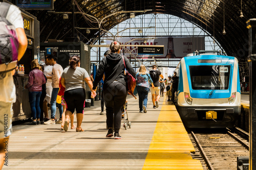 View on a sunny day of one of the platforms of the Retiro railway terminal in Buenos Aires, built of iron and glass.