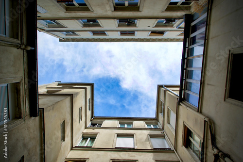 France, Paris, street scenes in Le Marais district, looking at the sky in a courtyard