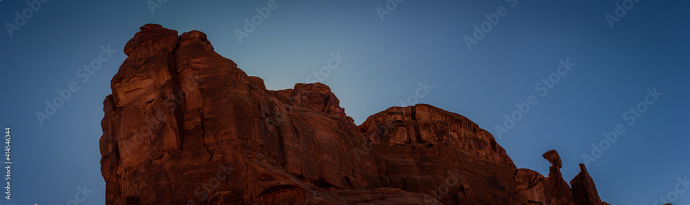 Close up of red sandstone massif against blue sky in Archen national park in Utah, america