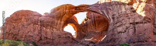 Panorama shot of red sandstone arches at summer sunny day in Arches national park in Utah, America © AllThings