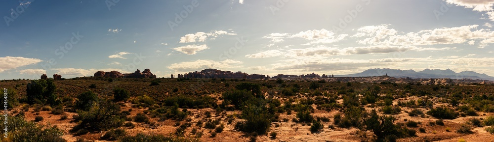 Panorama shot of red sandstones monoliths in desert of Arches national park in Utah, america
