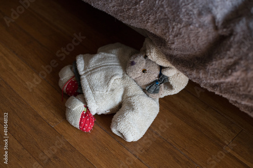 Teddy bear on the wooden floor