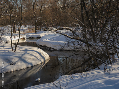 winter river with snowy banks