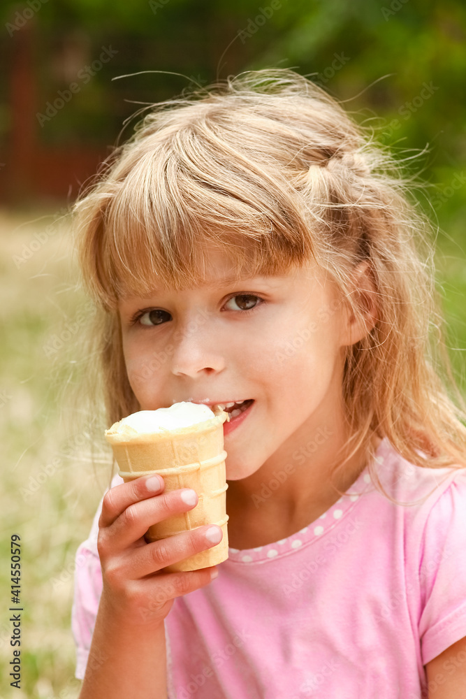 happy child eating ice cream outdoors in park happy child eating ice cream outdoors in park