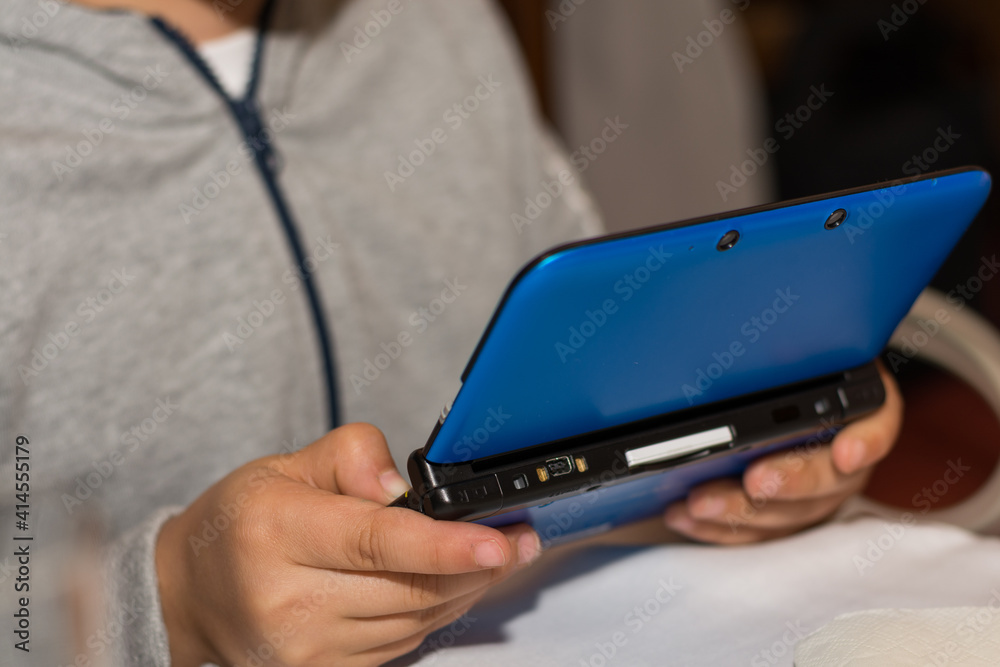 Child Playing On A Portable Computer Games Child Playing On A Portable Computer Games