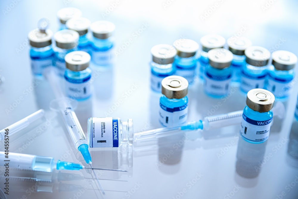 Coronavirus vaccine ampoules medical and syringe with a vaccine. Covid-19 vaccine research.