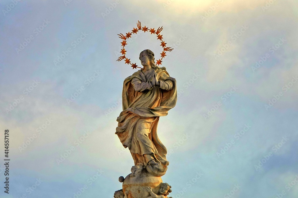 Fototapeta premium Statue in main square in Telc town, Czech Republic, UNESCO. Sunset.