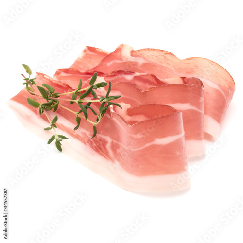 Italian prosciutto crudo or jamon. Raw ham. Isolated on white background