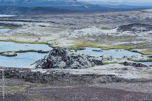 Iceland, Southern Highlands, Hrauneyjar. The rough volcanic landscape has small lakes among the rugged lava outcrops.