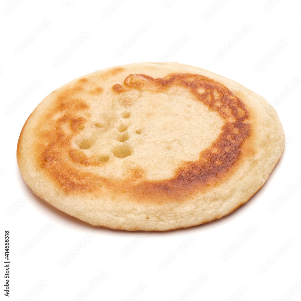 One pancake isolated on white background cutout. One pancake isolated on white background cutout.