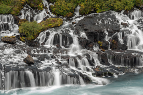 Iceland  Hraunfossar  Hvita River. Tiny cascades emerge from the lava to flow into the Hvita River over a half mile stretch.