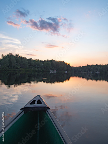 Canoe on a calm lake during sunset © Stock fresh 