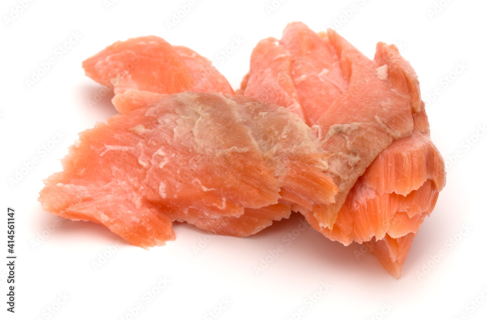 smoked salmon segments isolated on white background cutout. Prepared fish fillet fibres.