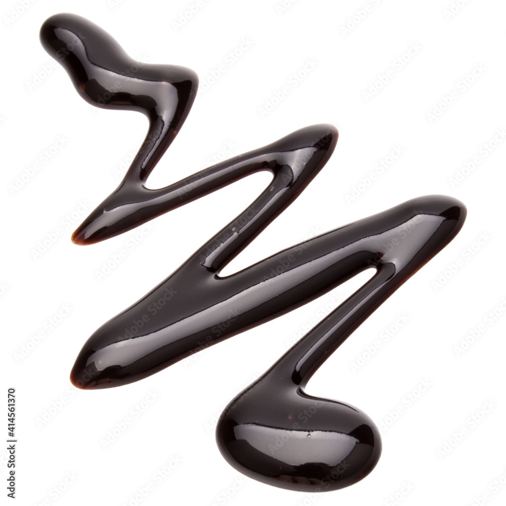 Obraz premium Chocolate syrup drop isolated on white background. Top view. .