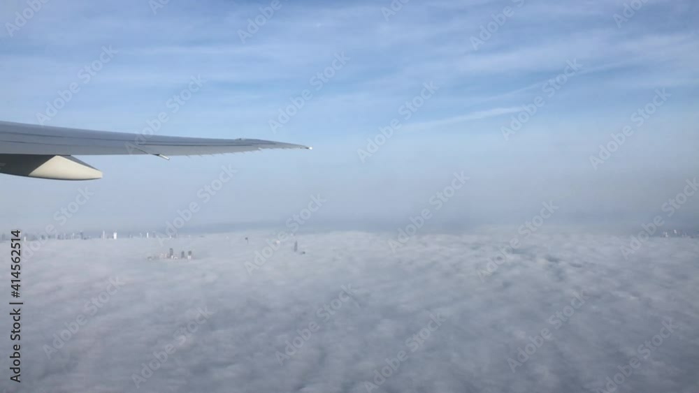 Aerial view on the Burj Khalifa and downtown Dubai covered in fog Aerial view on the Burj Khalifa and downtown Dubai covered in fog