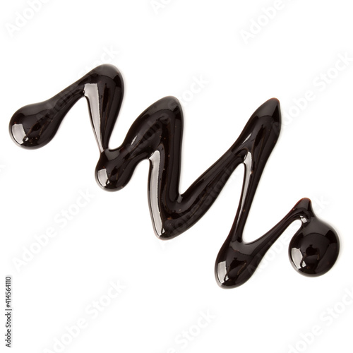 Chocolate syrup drop isolated on white background. Top view.