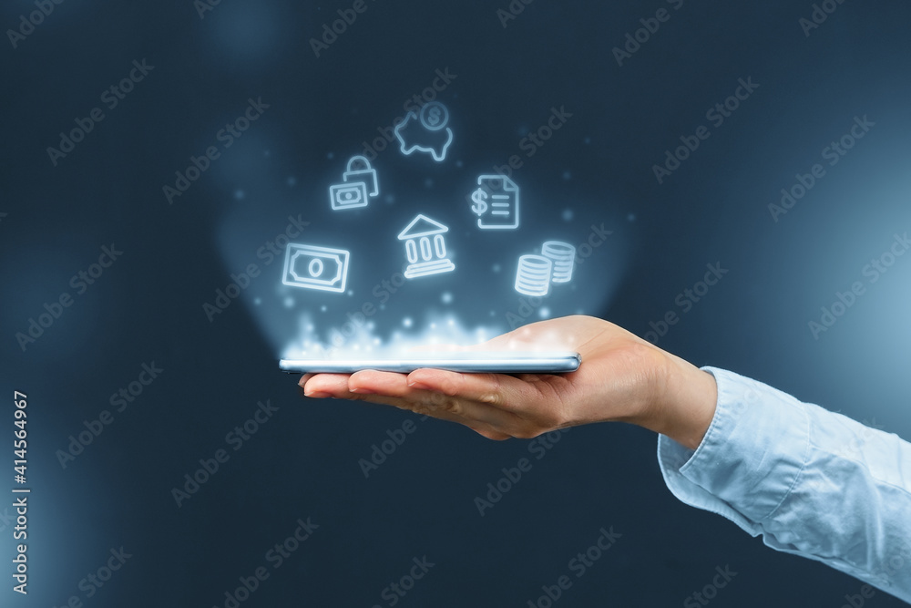 Person holds a smartphone with mobile banking icons projection. Person holds a smartphone with mobile banking icons projection.