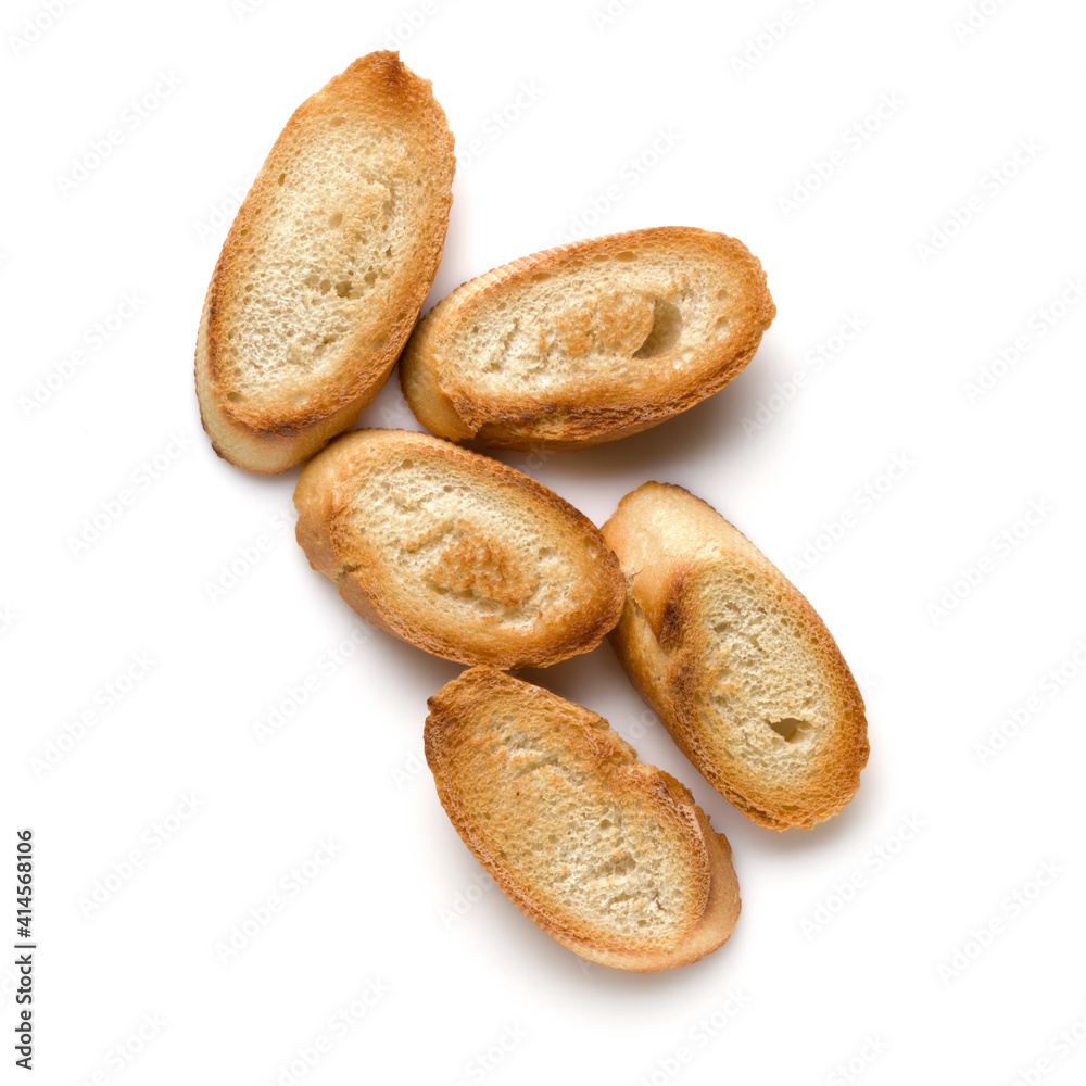 Toasted baguette slices isolated on white background close up.  Toast, crouton.   Top view.