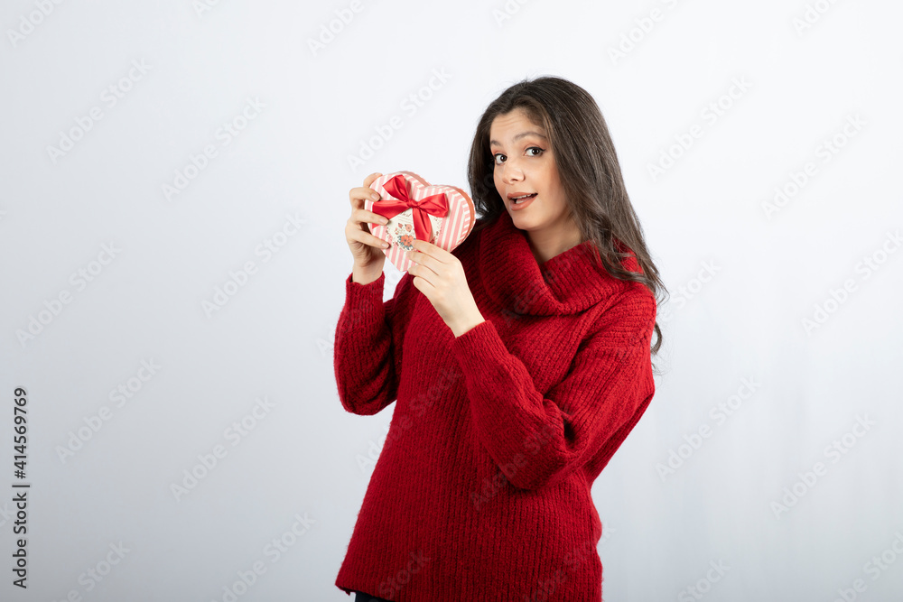Beautiful girl take a present box on her hands Beautiful girl take a present box on her hands