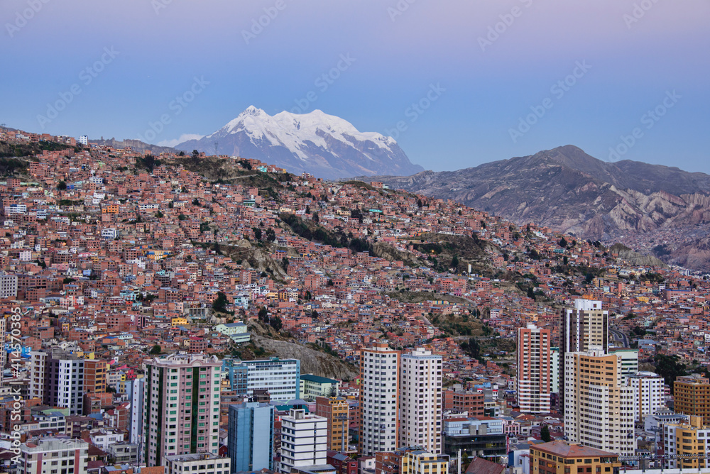 Sunset view with Illimani towering over the density of La Paz, Bolivia