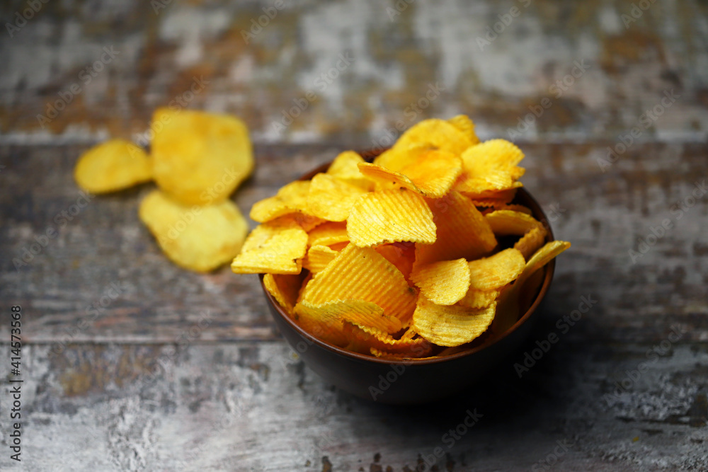 Cheese chips in a bowl. Yellow cheese chips.