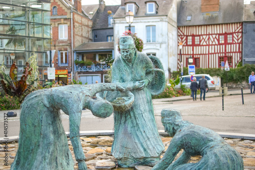 Photography The mussel gatherers statue, Les moulieres d'honfleur in the medieval fishing vi