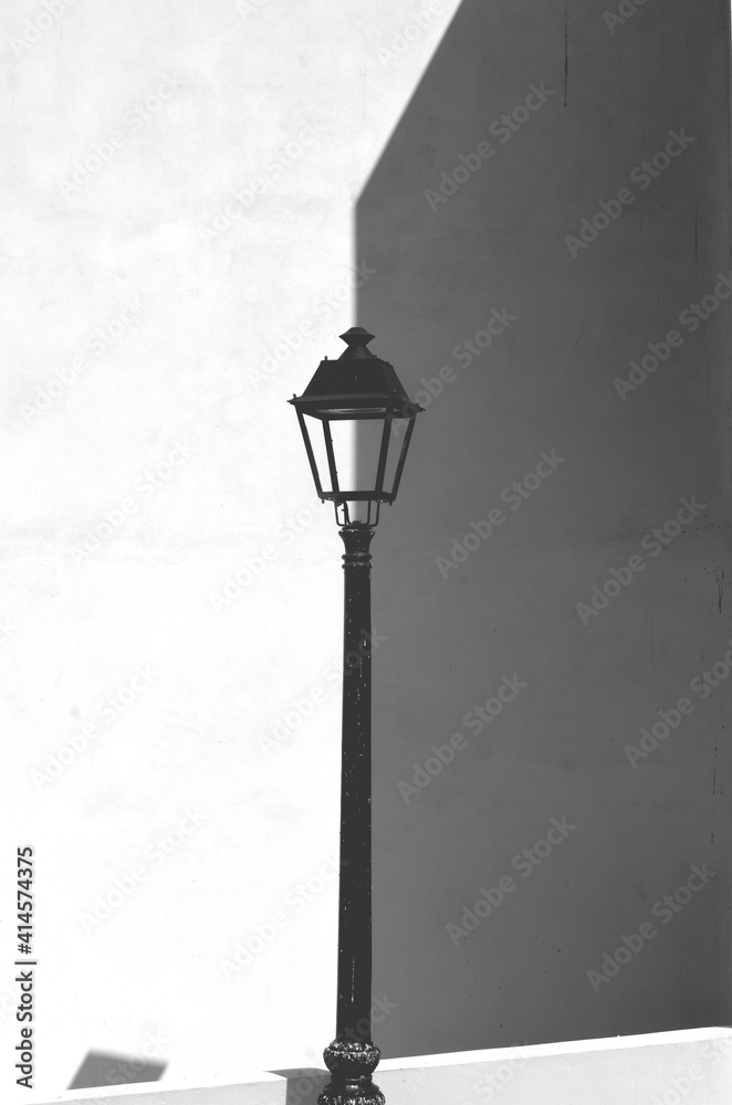 street lamp on white background monochrome, play of light and shadow,